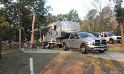 2011 Open Range Roamer M-287RLS, 2 slides, dual recliners, dining table 4 chairs, fold out sofa, 2 flatscreen TV's, am-fm-dvd-cd surrond sound, full size queen bed, 50 amp. heat pump heat and cool, furnance, dual gray water tanks, 4ea. 5 gal. propane