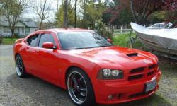 Beautiful red 6.1 Liter Dodge Charger SRT8. &nbsp;Sits on black 22" rims. &nbsp;Power everything, black leather and microsuede heated seats, MP3, CD, AM/FM/Satellite,DVD, Navigation, Blue Tooth, moonroof, 94,000 miles. &nbsp;Too many options. &nbsp;Price