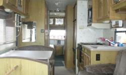 92 BRAVE. 33FT. CABINET UPGRADE,ONAN GENERATOR,454 CHEVY MOTOR THAT RUNS GREAT AS WELL AS TRANNY,FULL BATH WITH SEPERATE FULL SHOWER,ROOF AIR,OUTSIDE SHOWER,OUTSIDE STERI0,AWNING{17FT?],TWINS IN THE REAR,TABLE FOLDS TO BED,SOFA SLIDES TO BED,MOTOR AND