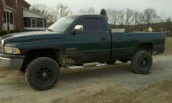 i have a 94 dodge cummins 4x4 5 speed it has after market wheels and tires,150 horse ddp injectors,it comes with a has can of paint and the roll in bed liner has new cd player an boost and egt gages runs and drives great has a greasecar system in it witch