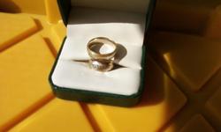 &nbsp;the wedding rings are less than 1 year old and in great shape. they are 14 k Gold, womans about size 6 and mens size 12. The rings are frosted a little with 5 crosses surrounding the band. call anytime, Thanks, Lana
&nbsp;