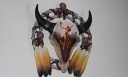 American Indian Decor-One piece is a Bradford Exchange skull with Indian painting on front with real feathers.&nbsp; It is about 9 inches in diameter.&nbsp;
The other two are figures and are very beautiful.&nbsp; They are from Ashton-Drake Galleries. Each