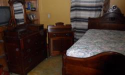The set includes a dresser with a mirror a side dresser and 3/4 size complete bed with wood rails.
All three pieces have original cherry finish over solid walnut.
The dresser with mirror does not have original pegs for the mirror and has repair to the