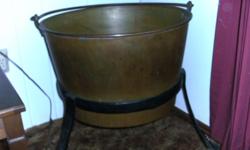 Solid Copper Apple Butter Kettle on cast iron stand. Approximate value $500.00 (reduced by 50%) asking 250.00 obo. Also offering an Antique Butter Churn, asking 100.00. Both items are authentic and in good usable or collectible condition.