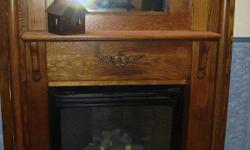 Excellent condition. Mantel has beveled edge mirror in middle, and candle stick holders.