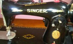 Singer.. Nice condition. Excellent quality. And still works. Not sure of age??? And comes with a matching stool.