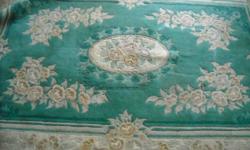 AQUA RUG WITH FLOWER DESIGN PURCHASED FROM HSN FOR OVER 150.00 8 FT LONG WITH FRINGE ON EACH END BY 17 INCHES WIDE