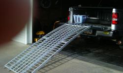 OXLITE 1500 LB. CAPCITY ALUMINUM THREE PIECE ARCHED LOADING RAMP FOR AN ATV OR MOTORCYCLE.ONLY BEEN USED TWICE. LIKE NEW ! I PAID OVER $450.00.