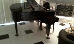 Beautiful TOKAI Baby Grand Piano well kept and would be a great addition to the decor in your home.