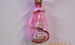 I cut a free form high polished rhodochrosite cab hand wrapped in a copper finish.
This stone has gorgeous pinks & white designs in the gem stone.
This is a one of a kind design hand cut and hand wrapped by Mcm designs locally in the USA.
The pendant has