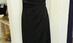This dress was purchased from a high end bridal salon.&nbsp; It is brand new, never worn, size 16, black w/ lace beaded gown.&nbsp; I paid $425.00, and would like to sell it for $299.00.&nbsp; I bought it for my daughter's wedding, and then ended up