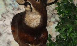 Big Boy is a Deer head-mount carved from solid wood tree trunk chunks. He weighs about 100 pounds. He measures 27" tip to tip at the widest part of his rack. His front legs and hoofs are included making him 52" tall. Measuring to the end of his nose he