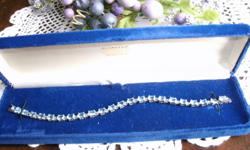 This Blue Topaz bracelet is 7" in length.
22 blue topaz gem stones placed
in a Sterling Silver setting.
Contact: Marlyvej@aol.com
