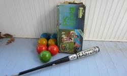Get ready to play with this Newport Franklin Prestige bocce balls and Easton softball bat! Easton bat is 34", 31 oz. Bocce ball set is imported from Italy. 8 balls, missing the scoring jack. Lots of fun - just don't try to hit the bocce balls with the