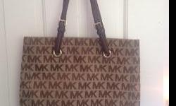 I have a Michael Kors handbag that is in brand new condition for sale. It is very clean, no rips and material is not worn out. Retail price was 228.00 and I am willing to sell for 175.00.