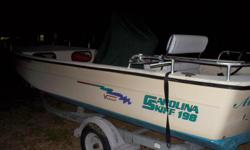 2005 19.8 V series CC Carolina Skiff with a 115 Yamaha four stroke motor, the boat is very wide, it measures 82" inside the front storage measures 52" from front to rear. Very good boat for crabbing or fishing . Comes with 05 EZ loader trailer. Comes with