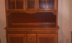 A two piece china cabinet, Very heavy 7 drawers.
