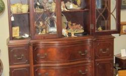 Maple china cabinet in great condition. Also has a secretary desk built into it.