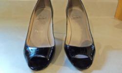 Black opened toes Christian Louboutin shoes with 4" heels size 37 1/2&nbsp; which is 7 1/2 us&nbsp; size. &nbsp;Very good condition $200.00 Contact Linda @ 356-6759