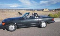 Classic 1989 560SL Mercedes Convertible Coupe Roadster in excellent condition for sale by owner (non-smoking). Exterior: Charcoal Gray w/ Lt. Gray leather interior/carpet. Trimmed with burled walnut wood panel. 5.6 liter (230 hp) V8 engine with a 4 speed