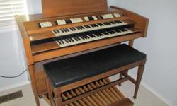 Older model Conn double keyboard organ with pedal bass and bench. Not perfect but plays well and looks great. It is yours free if you take it away.