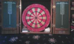 A DART BOARD THAT WAS A PROMOTIONAL "PRIZE" YOU GOT FOR SMOKING 'UN-GODLY' AMOUNTS OF MARLBORO CIGERETTES, IN THE "MARLBORO MILES" COLLECTION DAYS. ANY WAY, THIS IS IN BRAND NEW CONDITION, NEVER USED AND ALL THE DARTS, FLIGHTS, etc. ARE STILL IN THE