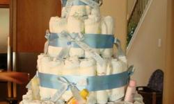 Are you looking for the perfect baby shower gift? Try a diaper cake!! This unique gift makes the perfect centerpiece at your special occasion!!
Boy, girl, theme, or personalized, I do them all!!!
My cakes are four tiers and are made with 150 diapers!