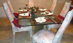 Beautiful rectangle glass table and glass base, etched, dining room table with 6 high back padded chairs. Hardly used in great condition. I live in Coral Springs FL.
The chairs are a white with mauve, seafoam and light blue splashes.
Really worth the