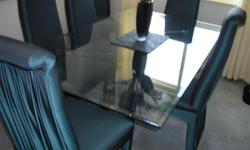 Glass table 42x72 with six chairs, fabric color teal. In very good condition. new table coming must sell&nbsp;250.00 or b/o.