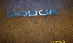 I HAVE A DODGE EMBLEM THAT I THINK ATACHES TO FENDER I DON'T KNOW WHAT YEAR I ADDED PICTURES IF YOUR INTERESTED CALL 816-632-2744 OR E-MAIL pfitzgerald551@centurytel.net r call 816-632-2744