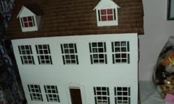 Colonial Williamsburg style; 30" wide, 28 1/2" tall, 16" deep; 3 stories, hand made with front and side door; Cedar shingles on roof; some furniture and dolls.