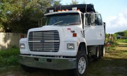 1994 Ford L 8000 ,Original tri-axle Dump Truck. This truck is ready to use with a 300 cummings engine -8LL Speed Eaton Fuller transmission.
Steel Dump body ,air release gate ,power tarp control - Hendrixson spring suspension.