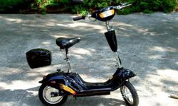 JUST IN TIME FOR CHRISTMAS!
Sun-L Electric Scooter. Excellent condition, like new! Polished up and looks just like new. No road dust or grease on wheels, gears, etc. Used very little. Brand new batteries just installed. 24 Volt 500 Watt motor. With