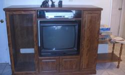 large entertainment center,drawers and shelves and two sides,one side has racks for c.d.storage.also included is sanyo 25 inch t.v,c.d.player and tape player,tape player needs to be cleaned it seems, c.d player does work great..glass doors and drawer in