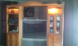 Light oak wooden entertainment center like new, two lights built in both work , lots of storage.
T.v is 52 inch can be included for another $250.00&nbsp;&nbsp; please call Chris or Wendi @ --