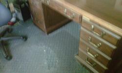 Executive style desk with matching credenza. Moving my office and need something smaller. Please call 931-580-1965.