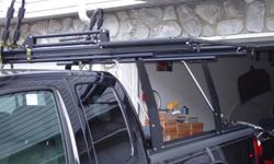 side load roof rack used for kayak' Can be used for anything. Pull out & down with 30lb. lift assist. see pics. cost $400.00 new. pics are just strapped on my new truck. this rack was on my old truck cap wich had a lift kit. great for short or not real