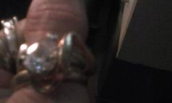 Costume Jewelery size 7 women size finger. Very pretty to wear alone or with other rings. It is a used ring s