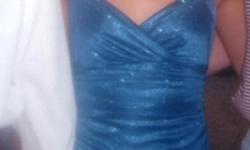 Blue sparkles, criss cross in back, floor length, size S. Purchased at Debs for $125.