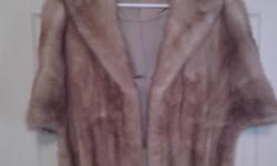 Real fur with satin linning . See Photo I am in Sebring but it wasn't there to choose from the list.