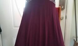 This has only been worn once and is in Like New condition. The dress is a maroon color and is approximately a size 2-4. It is floor length. The back has only a sequined strap and is open to just above the hip line. It is has only one strap that comes from