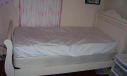 White sleigh bed...twin with dresser. New mattress and box spring