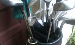 Tees,golf balls,clubs,bag,cleaning brush, glove.