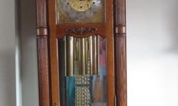 THIS IS A REALLY NICE SLIGH GRANDFATHER CLOCK
IT STANDS 7'1" TALL AND MEASURES 20" WIDE AND 12" DEEP
&nbsp;IT HAS GLASS ON 3 SIDES AND IS MIRRORED INSIDE THE BACK.&nbsp; IT CHIMES ON THE QUARTER HOURS
LIKE NEW, CLEAN, RUNS GREAT.&nbsp;
SERIOUS INQUIRIES