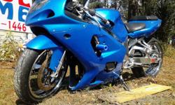 2000 Suzuki gsxr 750
25k miles
Oil changed every 2500 miles with royal purple
No leaks or knocks
House of kolor candy blue paint
Yoshimura TRS Exhaust
New tires
Exoticycle 12" Stretch
New rotors
New sprocket
New battery h.i.d lights
Custom stereo 200 watt