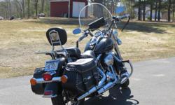 2005 FLSTC Black Heritage Softail Classic in mint condition.&nbsp; Lots of extra crome parts and a one time owner. 16600. miles and recondition bags.&nbsp; Helmets, leather jacket, boots, clothing etc., also for sale as well.&nbsp; Have to see to really
