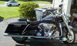 2007 Road King, less than 6,000 miles, mint condition. The bike comes with the following items:
1. Stock seat and Mustang touring seat with rider back rest.
2. Vance and Hines Oval Dual exhaust system.
3. Detachable passenger back rest.
4. Two windshields
