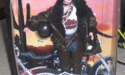 You are looking at a new box Collector Edition Harley Davidson Barbie doll. She is the second release of the Harley-Davidson . Very beautiful doll!!
Barbie has long red hair and riding gear complete with distressed faux leather, faux fur, studs, buckles,
