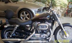 Harley Davidson Sportster XL
1200c
2500 mi.
black and chrome