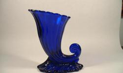 Heisey Glass Company "Warwick" (No. 1428) Stiegel Blue seven inch Horn of Plenty vase. Marked on bottom. Circa 1933-57.
Can be viewed at the Patriot Antique Center, 615 West King Street, Martinsburg, WV&nbsp; 25401 -- () -.